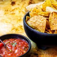 Chips & Salsa · Tortilla Chips served with a zesty Salsa.