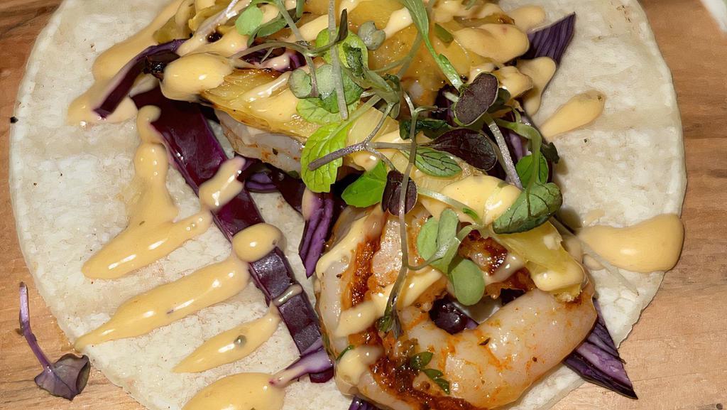 Lime Shrimp Taco · With marinated shrimp, chipotle, cabbage, pineapple, lime.