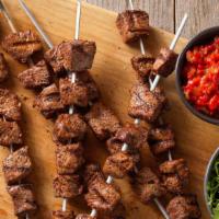 Beef Shish Kebab  · 3 beef skewers comes with rice, salad and white sauce.