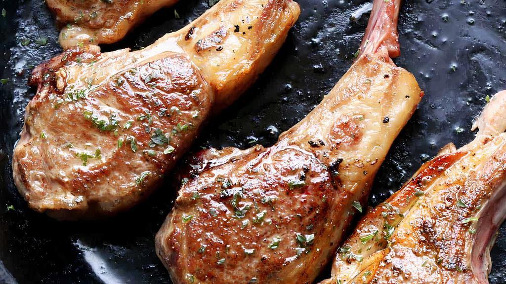 Lamb Chops · 3 pieces of Marinated Lamb Chops comes with Rice, Salad and white sauce.