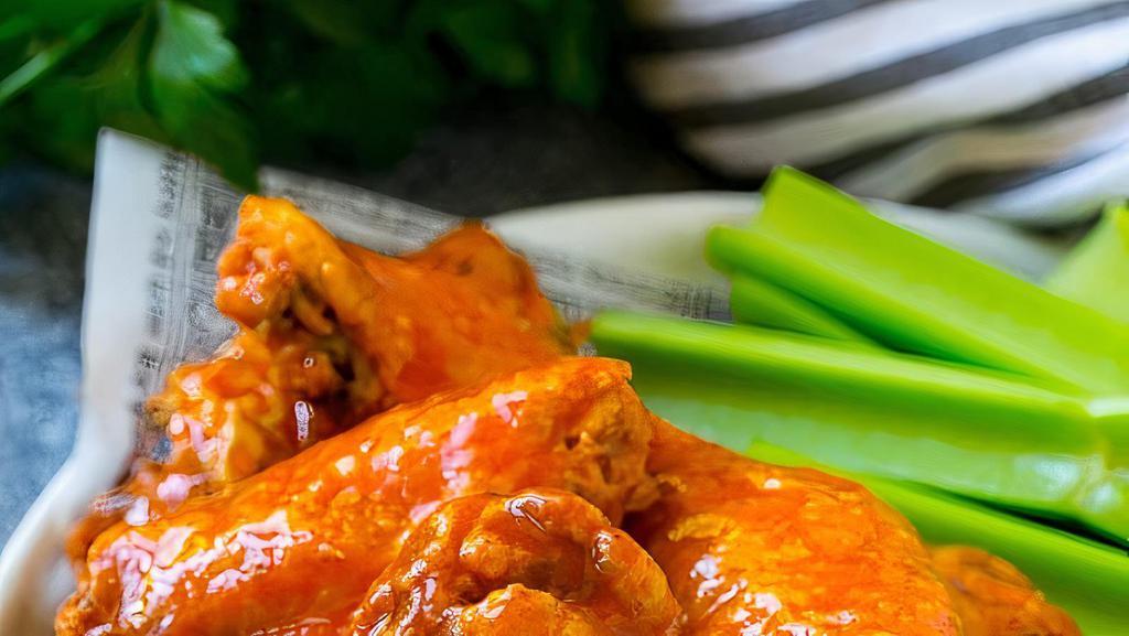 Buffalo Wings  · 7 pieces wings of a chicken coated in sauce and served with blue cheese dressing.