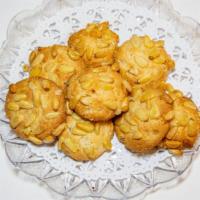 Pignoli Cookies · 1 lb Hand Made classic Pine Nut Cookies. Made with imported Italian pignolis.