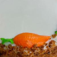 Carrot Cake · Made with fresh carrots, honey, walnuts covered in cream cheese icing.  Very moist.