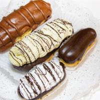 Mini Eclairs · Specify open or closed.  Open are filled with chocolate custard and topped with whipped crea...
