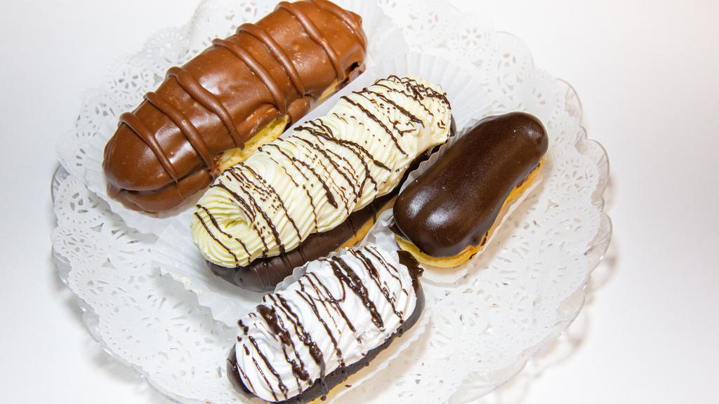 Mini Eclairs · Specify open or closed.  Open are filled with chocolate custard and topped with whipped cream. Closed are filled with vanilla custard.