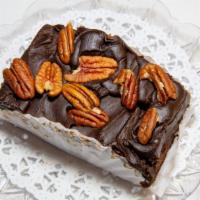 Brownies · covered in fudge with pecan nuts.