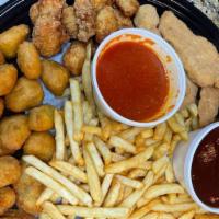Appetizer Sampler · Onion rings, mozzarella sticks, poppers, chicken nuggets and French fries.
