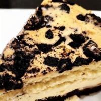 Slutty Brownie Cheesecake  · A layer of chocolate chip cookie, fudge brownie, oreo cookie, and our classic new york chees...