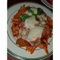 Chicken Parmigiana · Fried chicken breasts topped with home-made marinara sauce, baked with mozzarella cheese and...