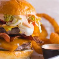 Double Trouble Burger · Two 5 oz. Signature blend patties topped with bacon, cheddar and American cheeses, lettuce, ...