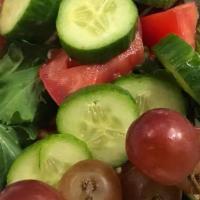 Green Salad · Fresh green salad with dressing on the side.