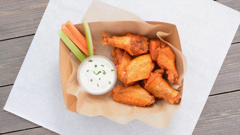 12 Classic Bone-In Wings · 12 Classic bone-in chicken wings tossed in up to 2 wing flavors and served with fresh carrot & celery sticks and homemade buttermilk ranch or blue cheese dressing
