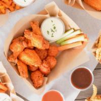 30 Classic Bone-In Wing Party Box · Party-size, ready-to-go boxes of 30 Classic bone-in chicken wings tossed with up to 3 wing f...