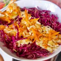 Tricolor Salad · Finely shredded white cabbage, finely shredded red cabbage, peeled and finely shredded carrot.