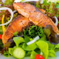 Grilled Salmon Salad · Fresh salad with pieces of grilled salmon.