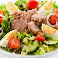 Tuna Salad · Fresh salad with pieces of grilled chicken and sliced avocado.