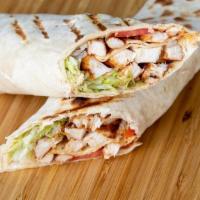 Chicken Buffalo Wrap · Wrap stuffed with pieces of buffalo chicken served with fresh lettuce and tomatoes, with you...