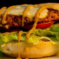 Cajun Chicken Sandwich · Cajun Chicken sandwich served with cheese, lettuce, and tomato.