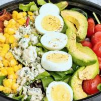 Traditional American Cobb · Mixed Greens, Hard-boiled Egg, Turkey Bacon, Crumbled Blue Cheese, Tomatoes, and Avocado wit...