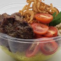 Kofte Kebap Bowl · Ground beef and lamb, basmati rice with turmeric, babagannoush, cherry tomato, crispy onion