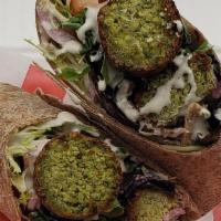 Falafel Wrap · Mix Green, hummus, tomatoes, pickled red Grilled onion, and tahini sauce