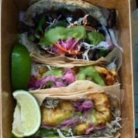 Tacos · Traditional tacos served on your choice of flour, corn or crispy tortilla served with shredd...