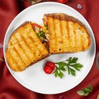 Fajitas O'Cluck Panini · Grilled chicken, cheddar cheese, roasted peppers, caramelized onions, salsa. Served with a s...
