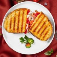 Bongiorno Panini · Grilled chicken, roasted peppers, fresh mozzarella cheese and pesto sauce. Served with a sid...
