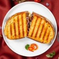 Russian Roulette Panini · Roasted beef, meunster cheese, caramelized onions, lettuce tomatoes, and russian dressing. S...