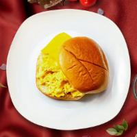 Ec Peasy Breakfast Sandwich · Scrambled egg, cheese, sliced tomato and caramelized onions served with your choice of sauce...