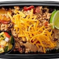 Chicken Tex Mex Bowl · Ground chicken sautéed with diced bell peppers, onions, tomatoes and black beans over steame...