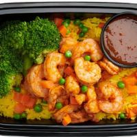 The Jamie G · Our signature spiced shrimp served over saffron-infused rice pilaf with a side of steamed br...