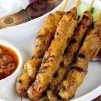 Satay Chicken Or Beef (5) · Hot & Spicy. Marinated grilled chicken or beef skewer served with peanut sauce