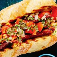Sándwich De  Chorizo Mexican  · Lechuga, tomate, cebolla, tocino, aguacate, queso americano blanco o amarillo / Lettuce, tom...
