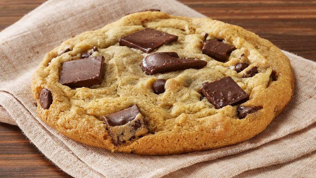 Triple Chocolate Chip Coookies · This cookie is made from David’s famous chocolate chunk cookie dough, generously topped with HERSHEY’S® MINI KISSES, semi-sweet chocolate chunks & milk chocolate chunks!