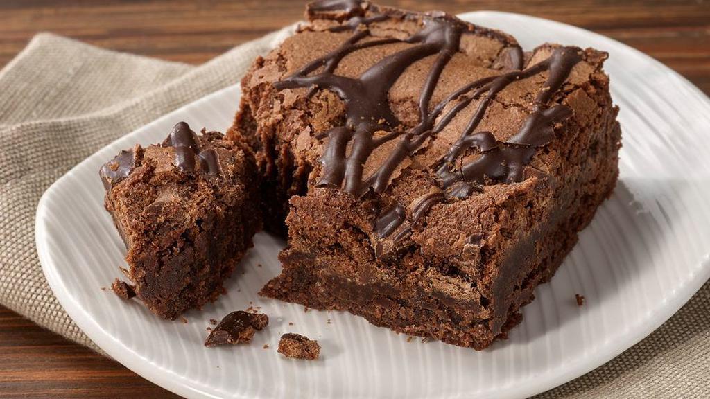 Indulgent Chocolate Brownies · Traditional chocolate decadence  with chocolate chips bits throughout and striped on top.