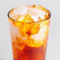 Thai Iced Tea · Black tea. A blend of black tea, vanilla, and cinnamon poured over ice and topped with half ...