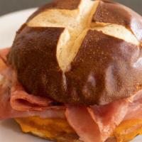 Pretzel Bun Ham Sandwich · Ham piled on melted cheddar cheese and a light pretzel bun