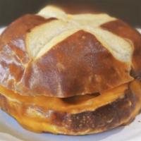 Hot Pretzel Bun Sandwich - Cheese Melt · Cheddar cheese melted between two slices of a hot pretzel bun.