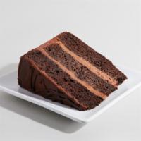 Chocolate Magic Cake · Moist, dark chocolate cake layered with chocolate mousse and covered in rich chocolate ganac...