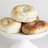 Bagel · Kettle boiled, ring-shaped yeast roll, baked to golden brown with a slight sheen.