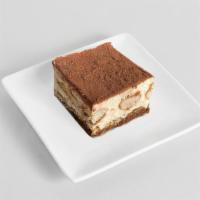 Tiramisu · Made with coffee brandy soaked sponge cake and tapped with clouds of light and soft mascarpo...