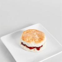 Biscuit With Raspberry Jam · Raspberry jam sandwiched between two slices of a warm and flaky biscuit.