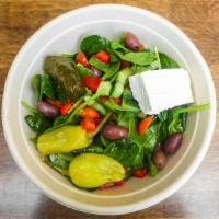 Greek Bowl · Baby spinach, feta, olives, onion, tomatoes, stuffed grape leaf, red wine vinaigrette