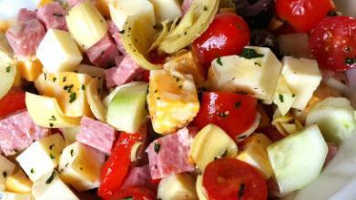 Cold Antipasto Salad · Garden salad with prosciutto, salami, provolone, fresh mozzarella, roasted peppers and olives.