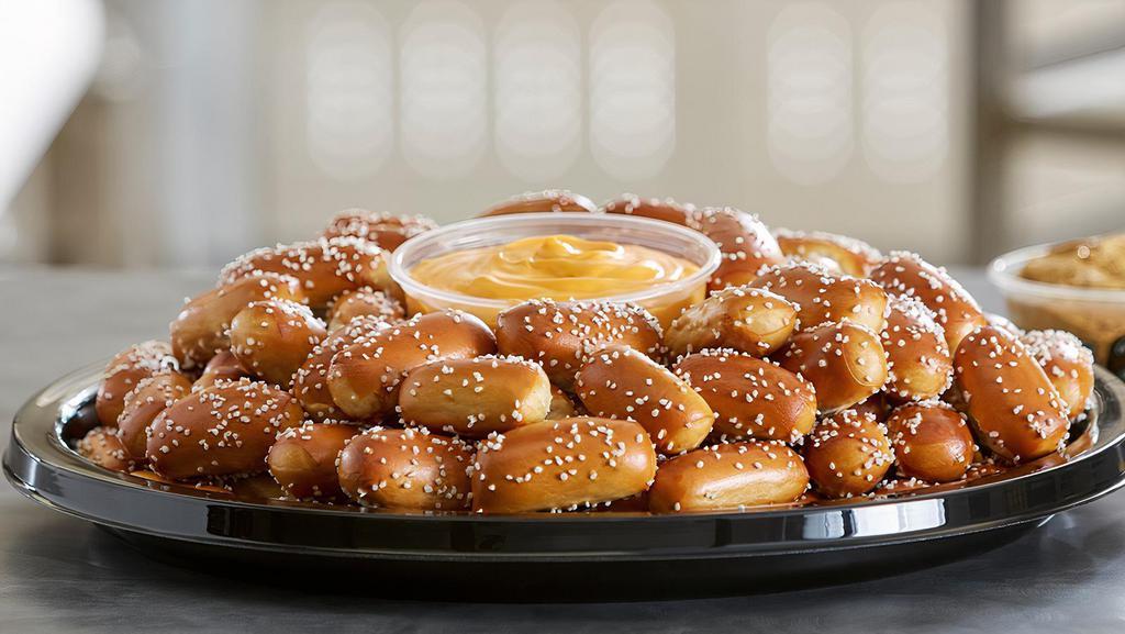 Party Tray - Small Rivet Tray · Pair your small size rivets party tray with any two of our wide assortment of pretzel dips. Prepared with approximately one hundred and twenty-eight salted rivets. Serves approximately 10-15 guests.