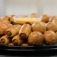 Mini Cheesesteaks & Mini Dogs Party Tray · 36 mini cheesesteaks and 36 all beef mini pretzel dogs with American cheese and includes 2 l...