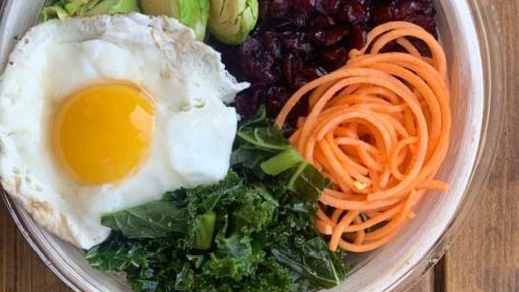 Honey Garlic Salad Bowl · Roasted Brussels sprouts, noodled sweet potatoes, chopped kale, dried cranberries, parsley, tossed in honey garlic dressing and topped with a fried free egg.