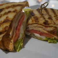 Backyard Chicken Sandwich · Grilled chicken on a pita bread with lettuce, tomato and fresh mozzarella.