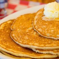 Pancakes · Two Delicious Pancakes Served With Maple Syrup on the Side.